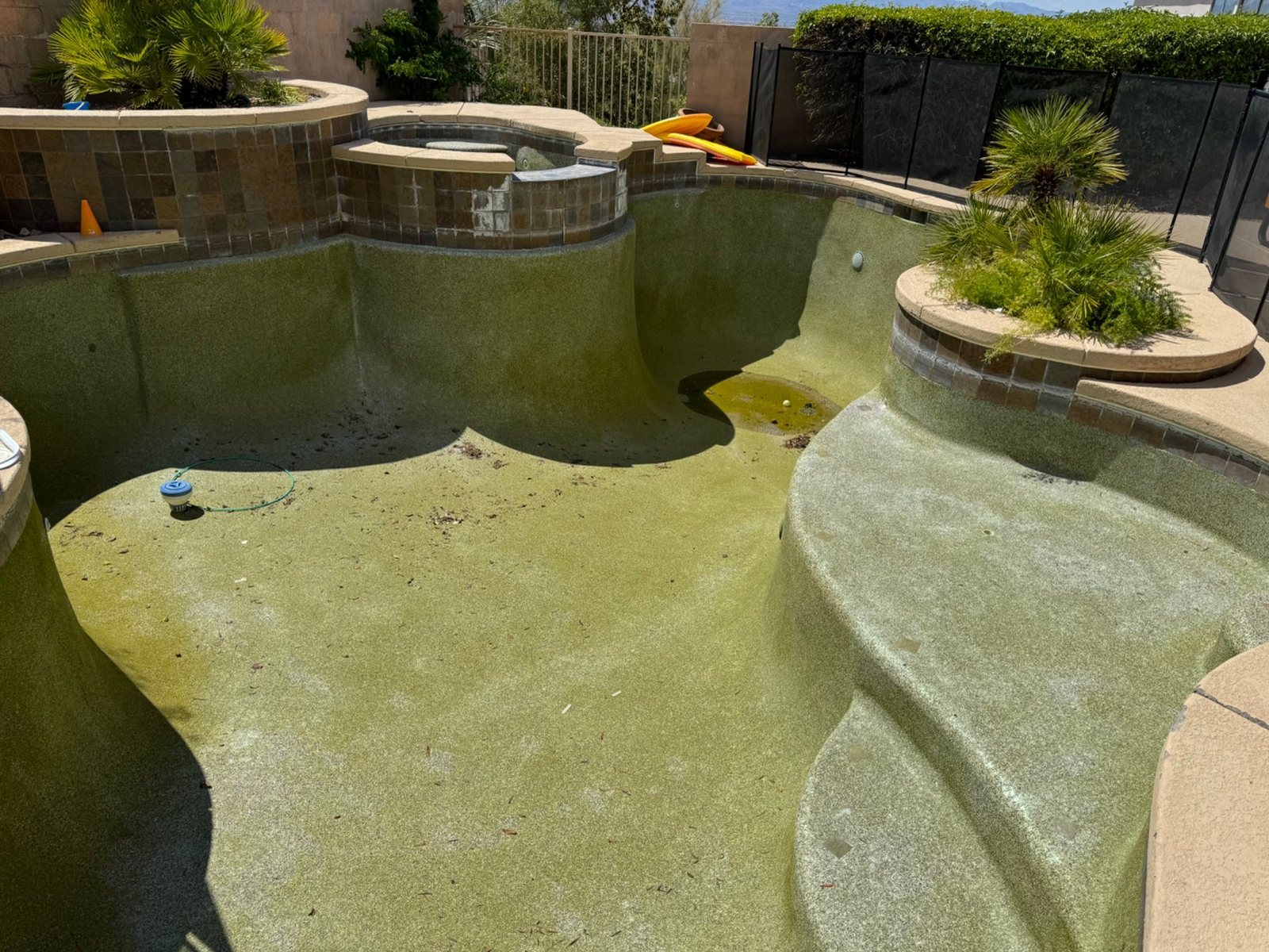 Residential pool surface before professional restoration work