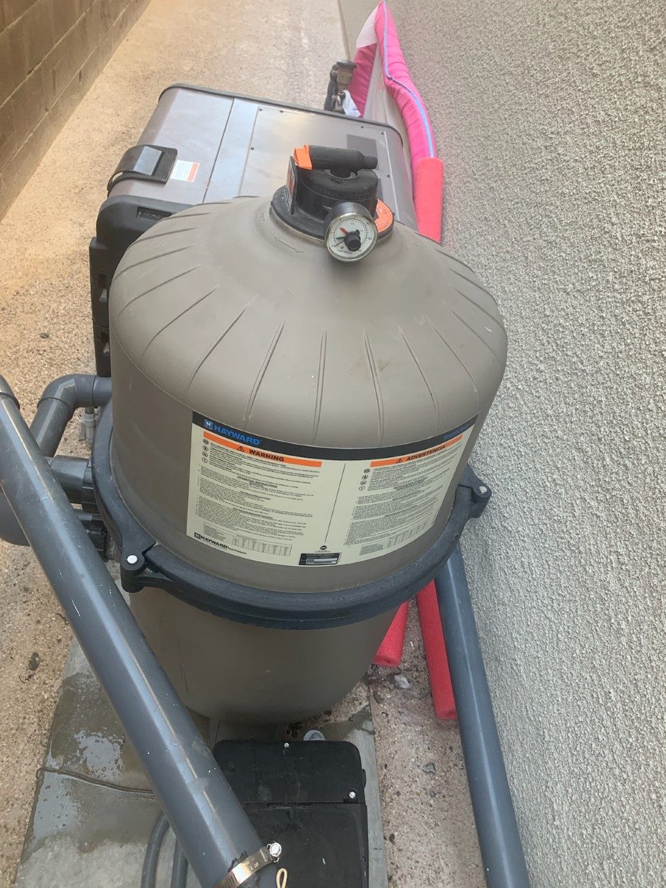 Residential cartridge pool filter on a local equipment pad