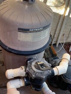 Hayward DE pool filter with multiport valve and connected plumbing