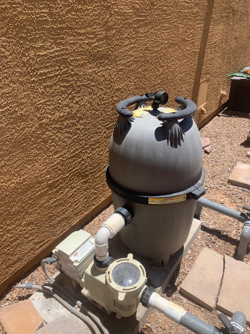 Close view of residential pool filter equipment and plumbing