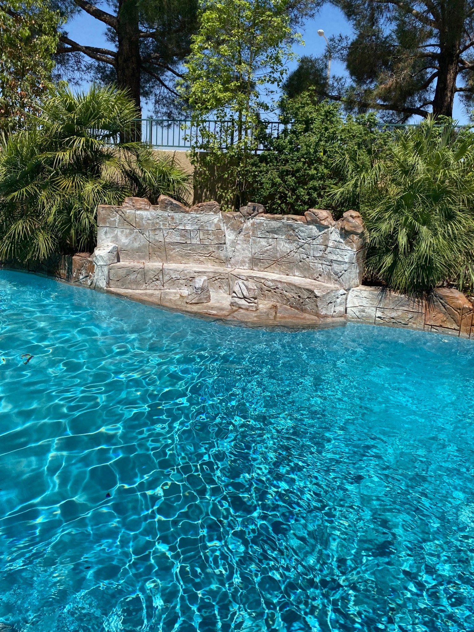 Clear residential pool supported by properly operating equipment