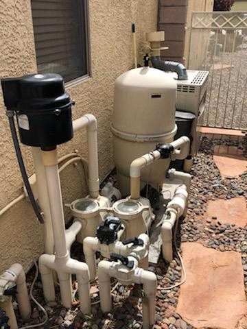 Complete residential pool equipment pad with plumbing and controls