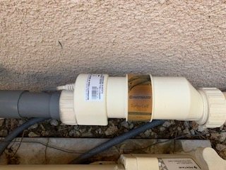 Close view of a pool salt cell and connected plumbing
